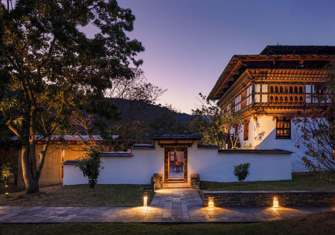 A luxury lodge in Bhutanese style set in blue pine forest